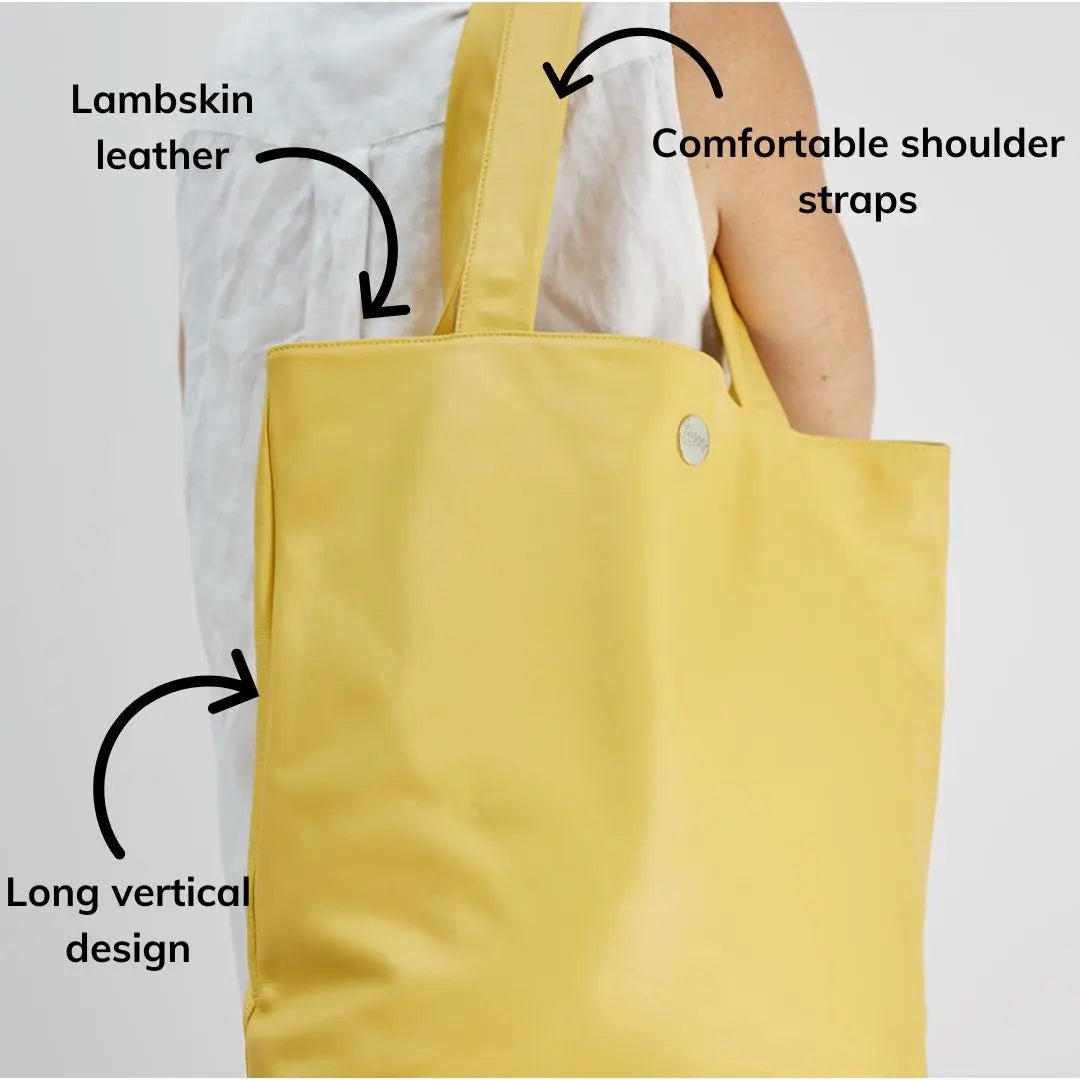 The I Appreciate Me yellow lambskin leather tote highlighting comfortable shoulder straps, lambskin leather and long vertical design